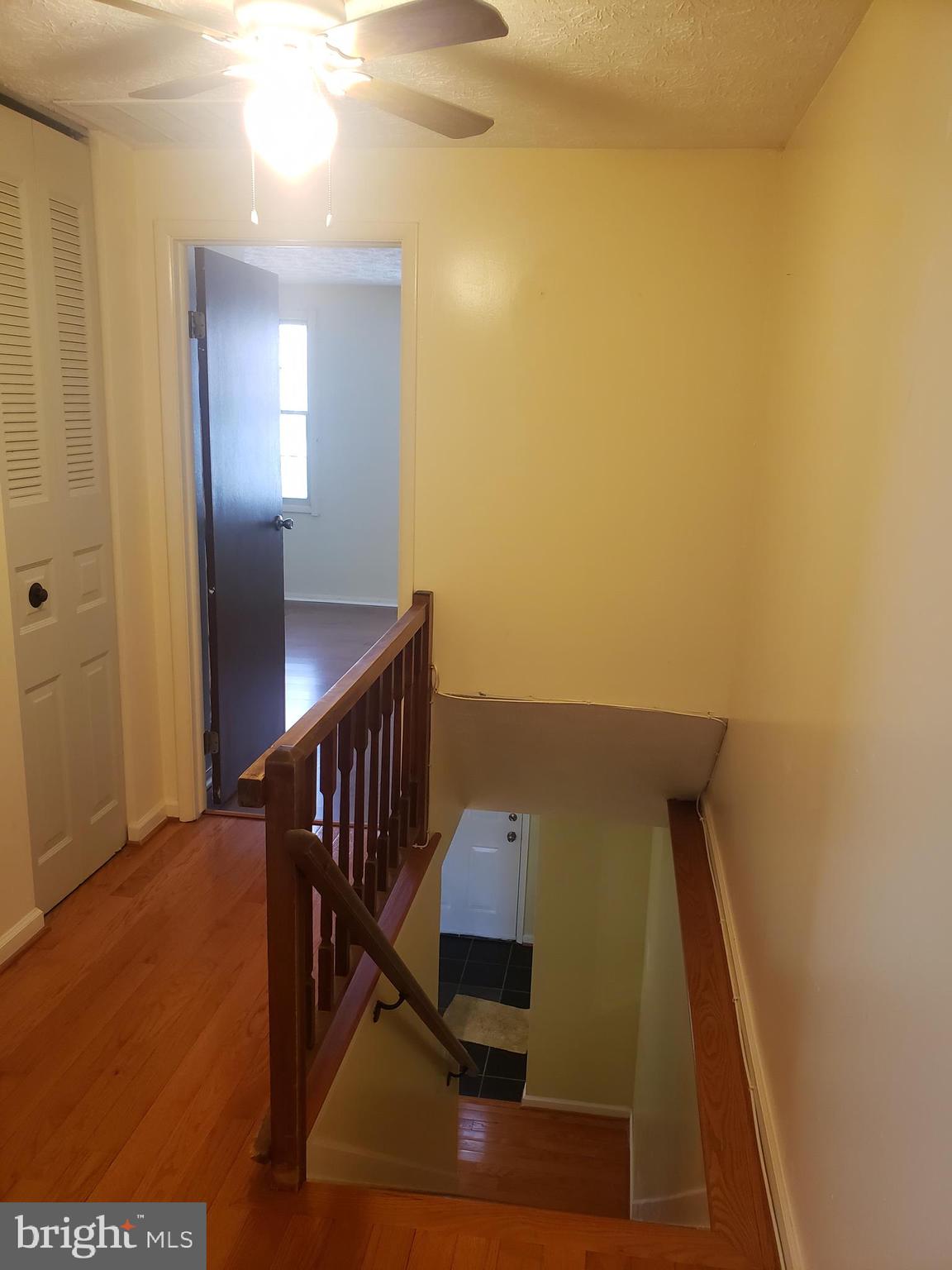 14582 Farmcrest Place Silver Spring, MD 20905 - Photo 12 of 19 a view of entryway and hall with wooden floor