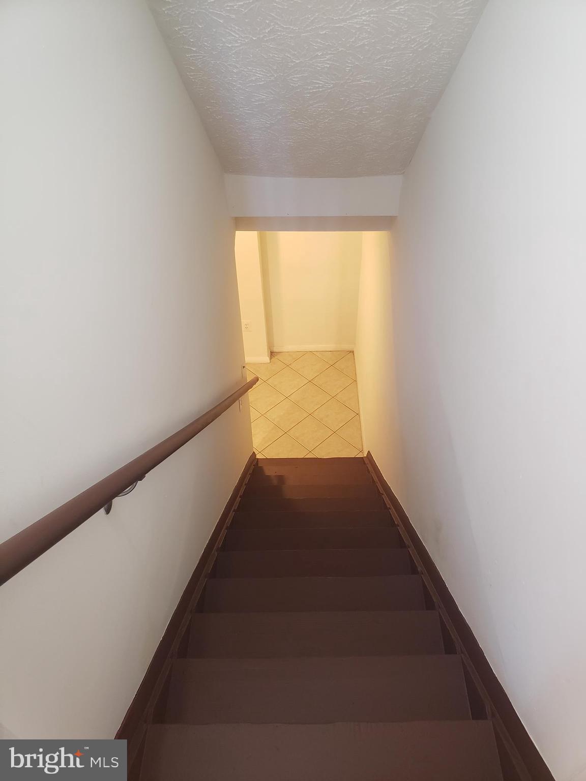 14582 Farmcrest Place Silver Spring, MD 20905 - Photo 13 of 19 a view of a hallway with wooden floor