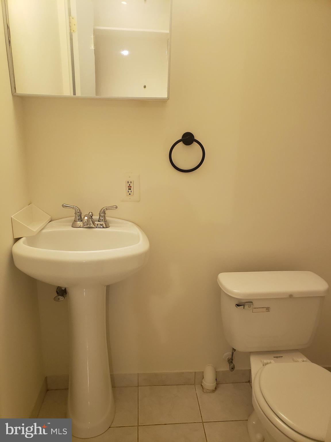 14582 Farmcrest Place Silver Spring, MD 20905 - Photo 15 of 19 a bathroom with a sink a toilet