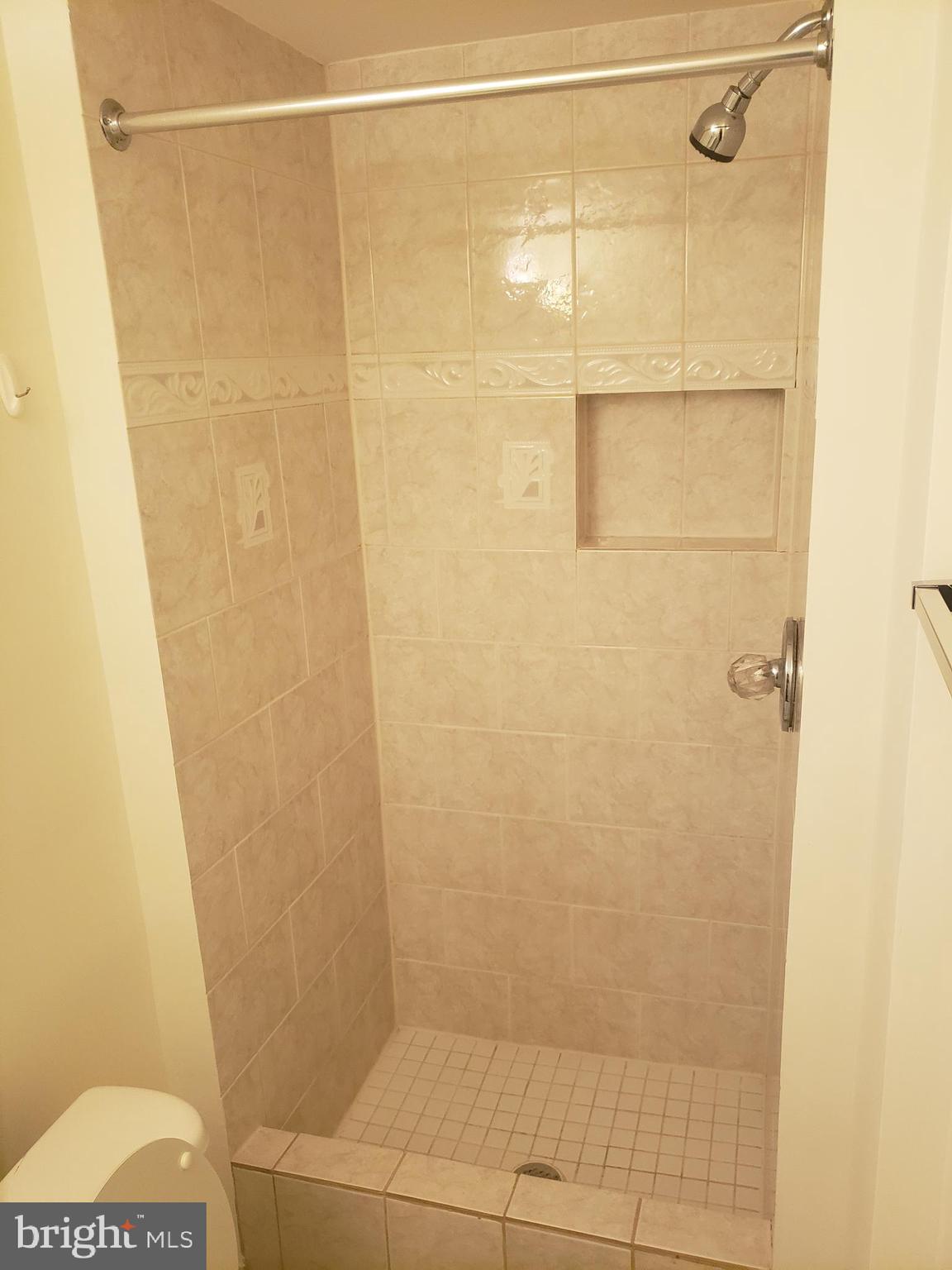 14582 Farmcrest Place Silver Spring, MD 20905 - Photo 16 of 19 a bathroom with a shower