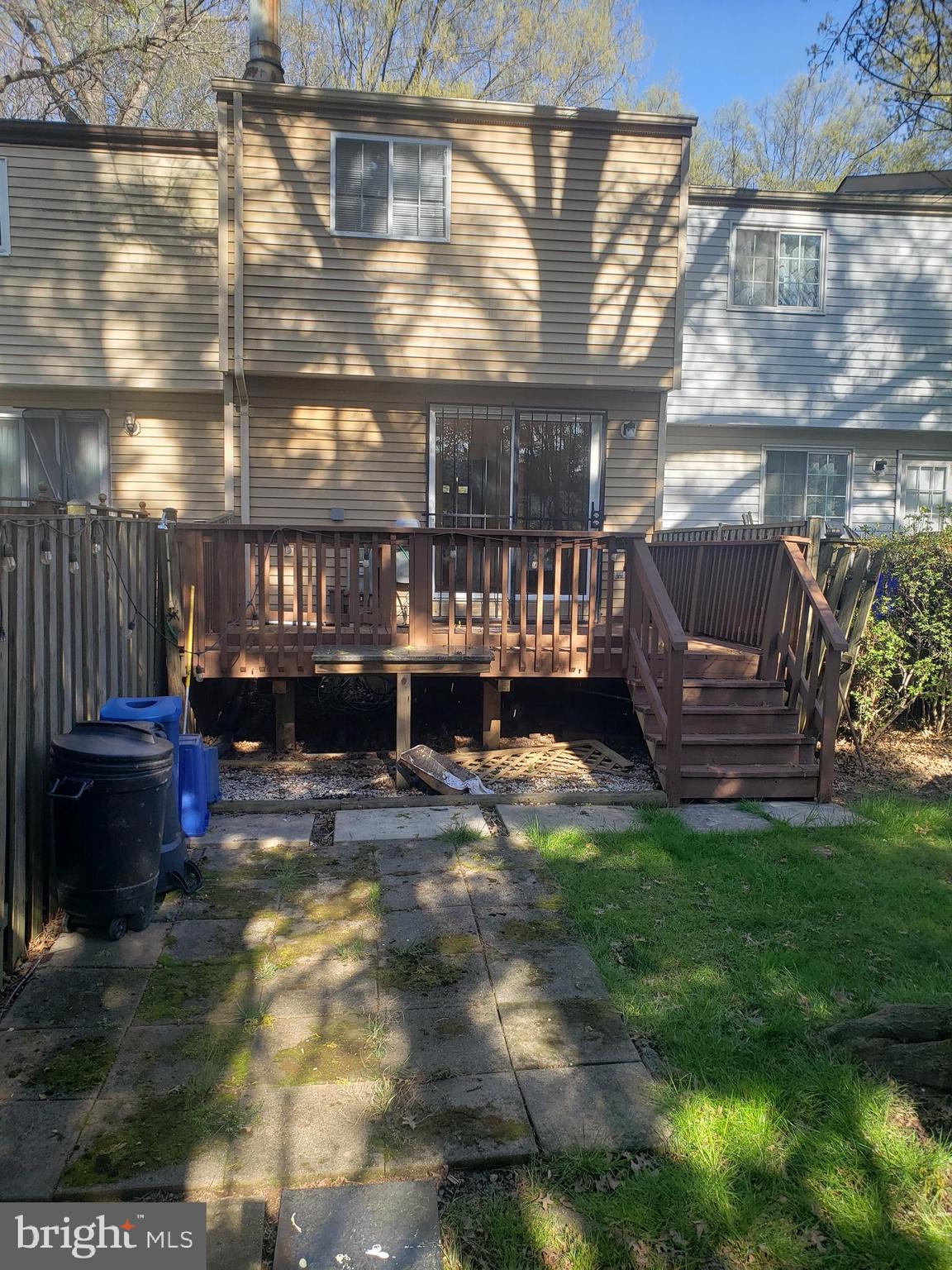 14582 Farmcrest Place Silver Spring, MD 20905 - Photo 19 of 19 a view of a backyard with plants and a patio