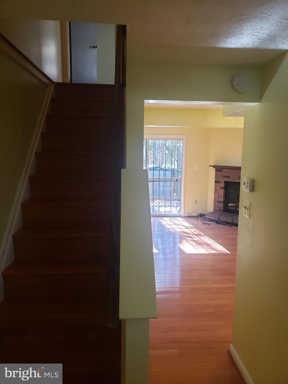 14582 Farmcrest Place Silver Spring, MD 20905 - Photo 3 of 19 a view of empty room with wooden floor