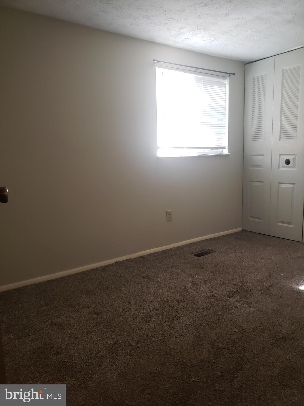14582 Farmcrest Place Silver Spring, MD 20905 - Photo 7 of 19 an empty room with a window