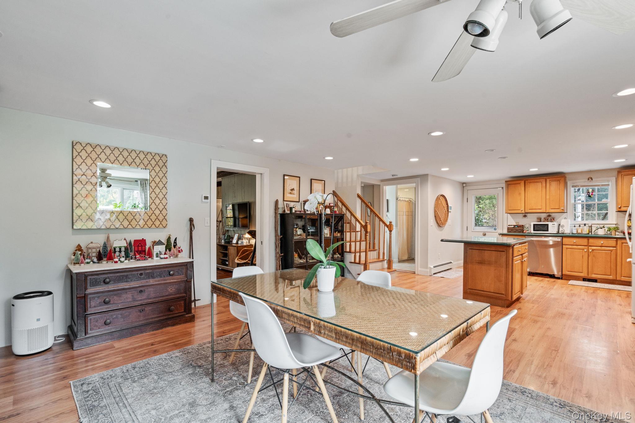 170 North Country Road Miller Place, NY 11764 - Photo 15 of 48 a living room with furniture and kitchen view