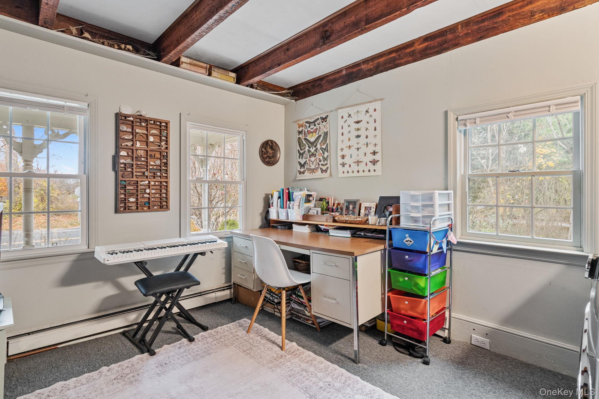 170 North Country Road Miller Place, NY 11764 - Photo 16 of 48 a view of a workspace with furniture and a window