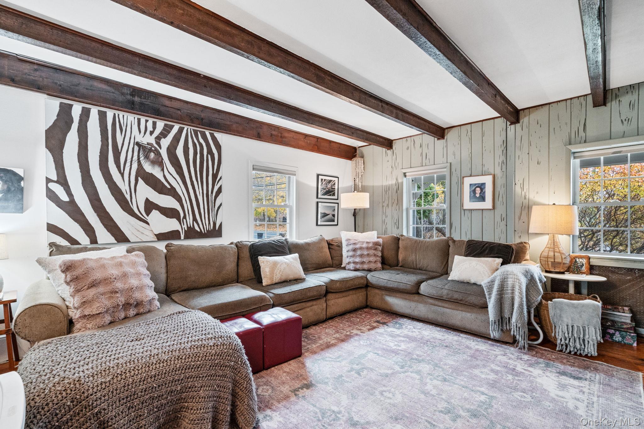 170 North Country Road Miller Place, NY 11764 - Photo 18 of 48 a living room with furniture or couch and a window