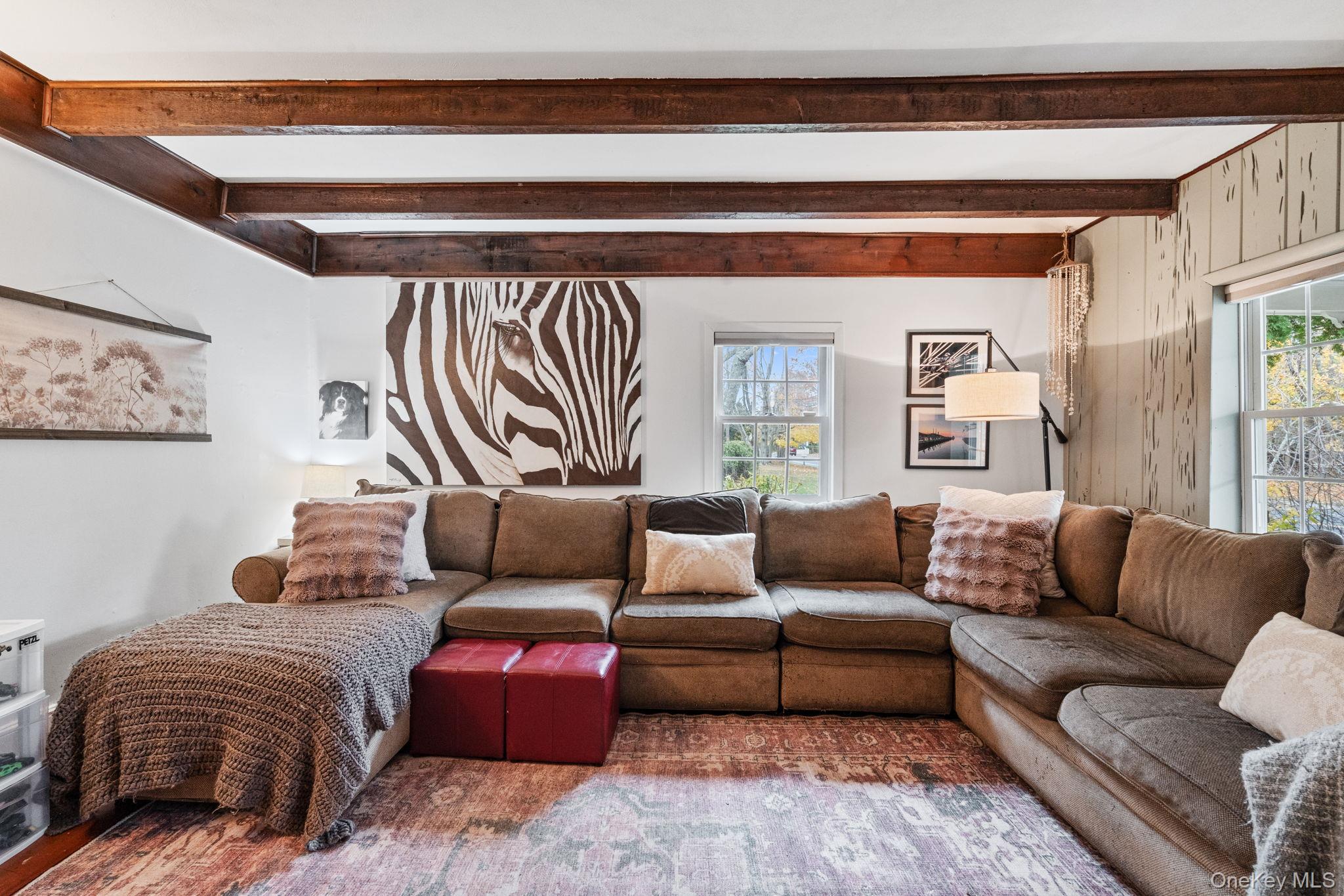 170 North Country Road Miller Place, NY 11764 - Photo 19 of 48 a living room with furniture and a large window