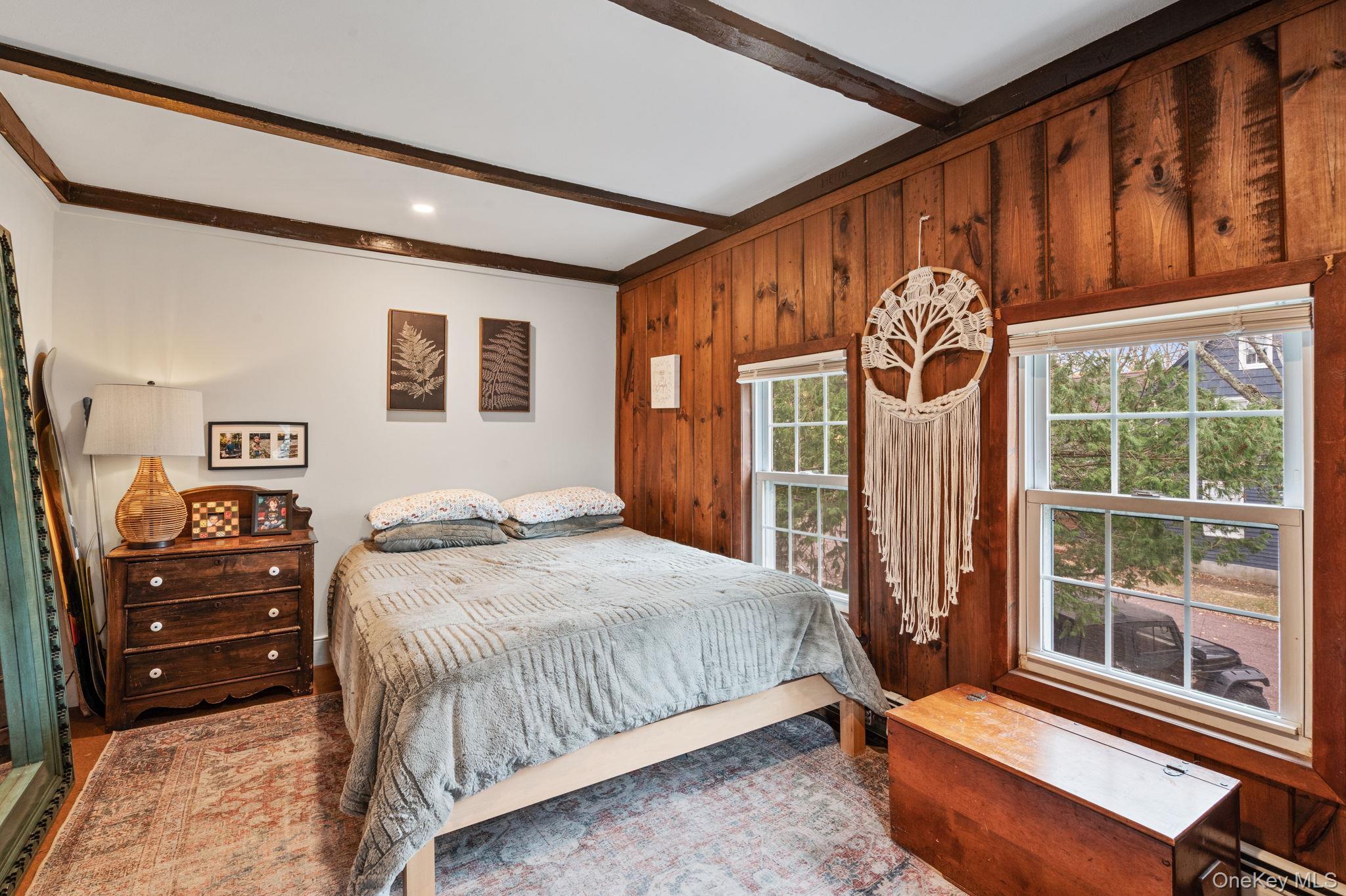 170 North Country Road Miller Place, NY 11764 - Photo 24 of 48 a bedroom with a bed and a window