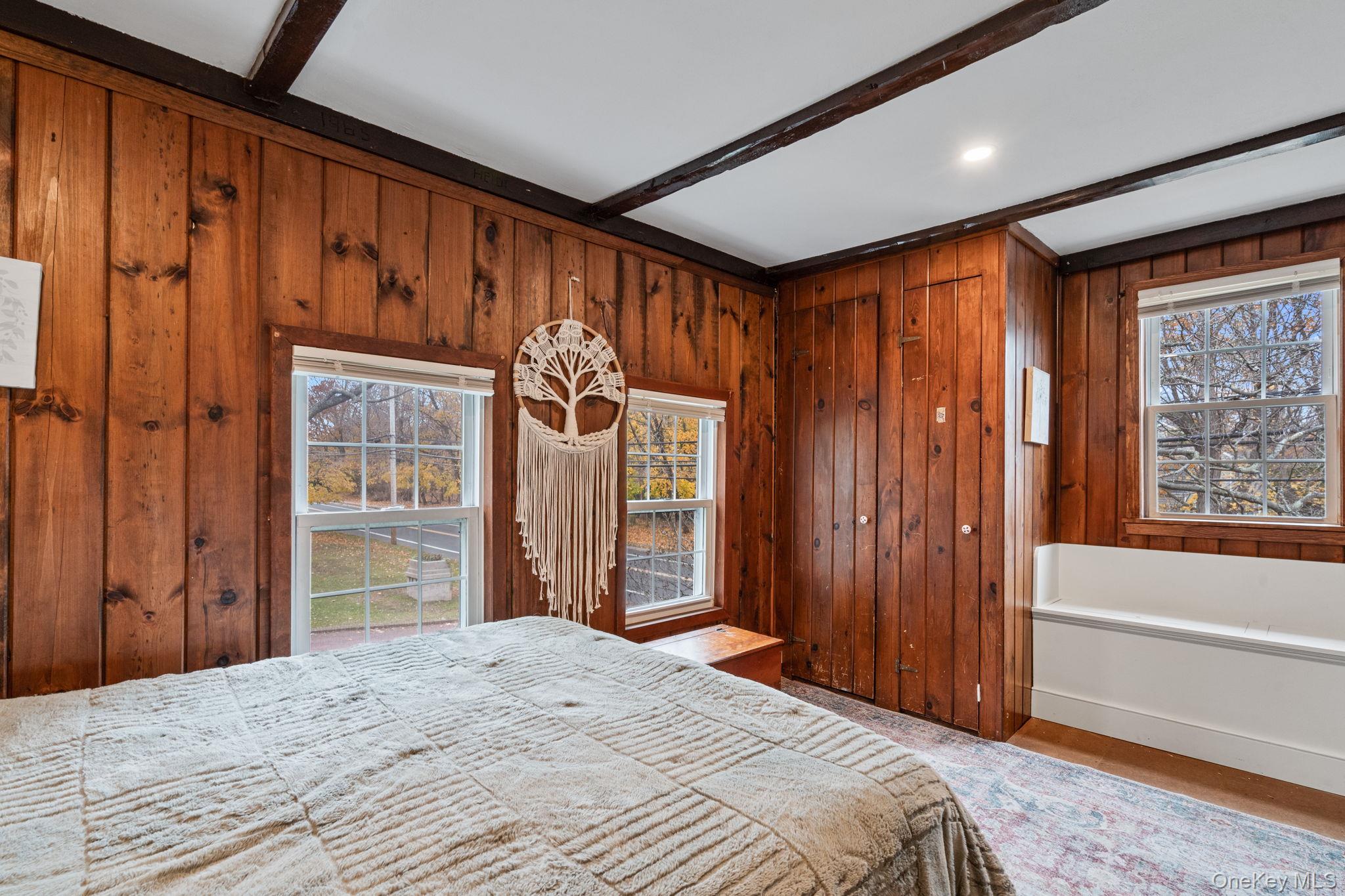 170 North Country Road Miller Place, NY 11764 - Photo 25 of 48 a bedroom with a bed and a window