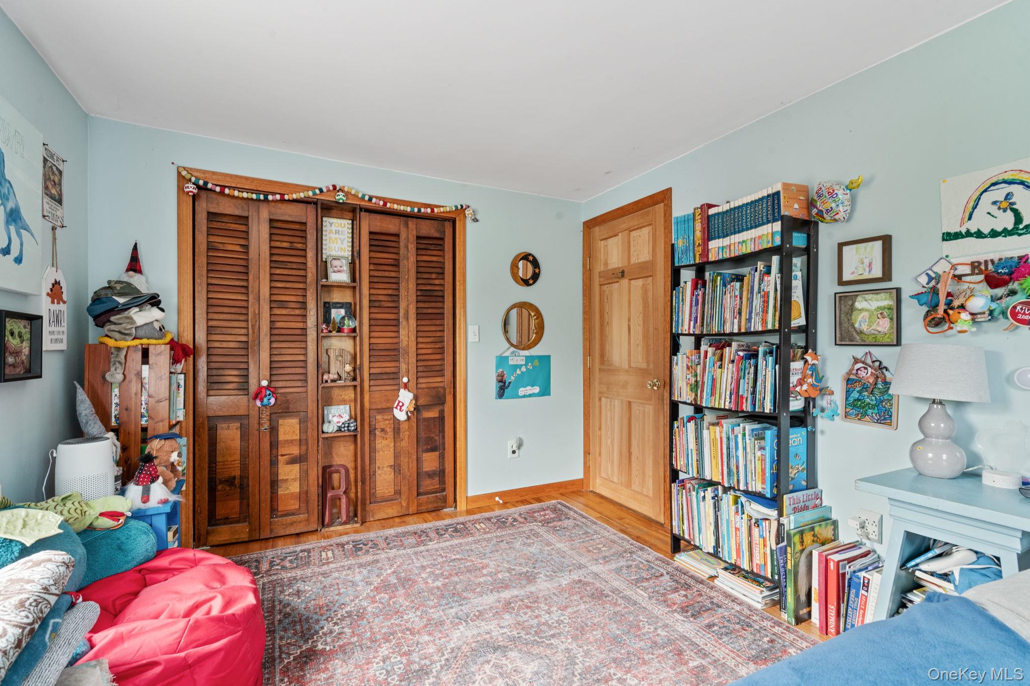170 North Country Road Miller Place, NY 11764 - Photo 29 of 48 a living room with lots of furniture and baby toys