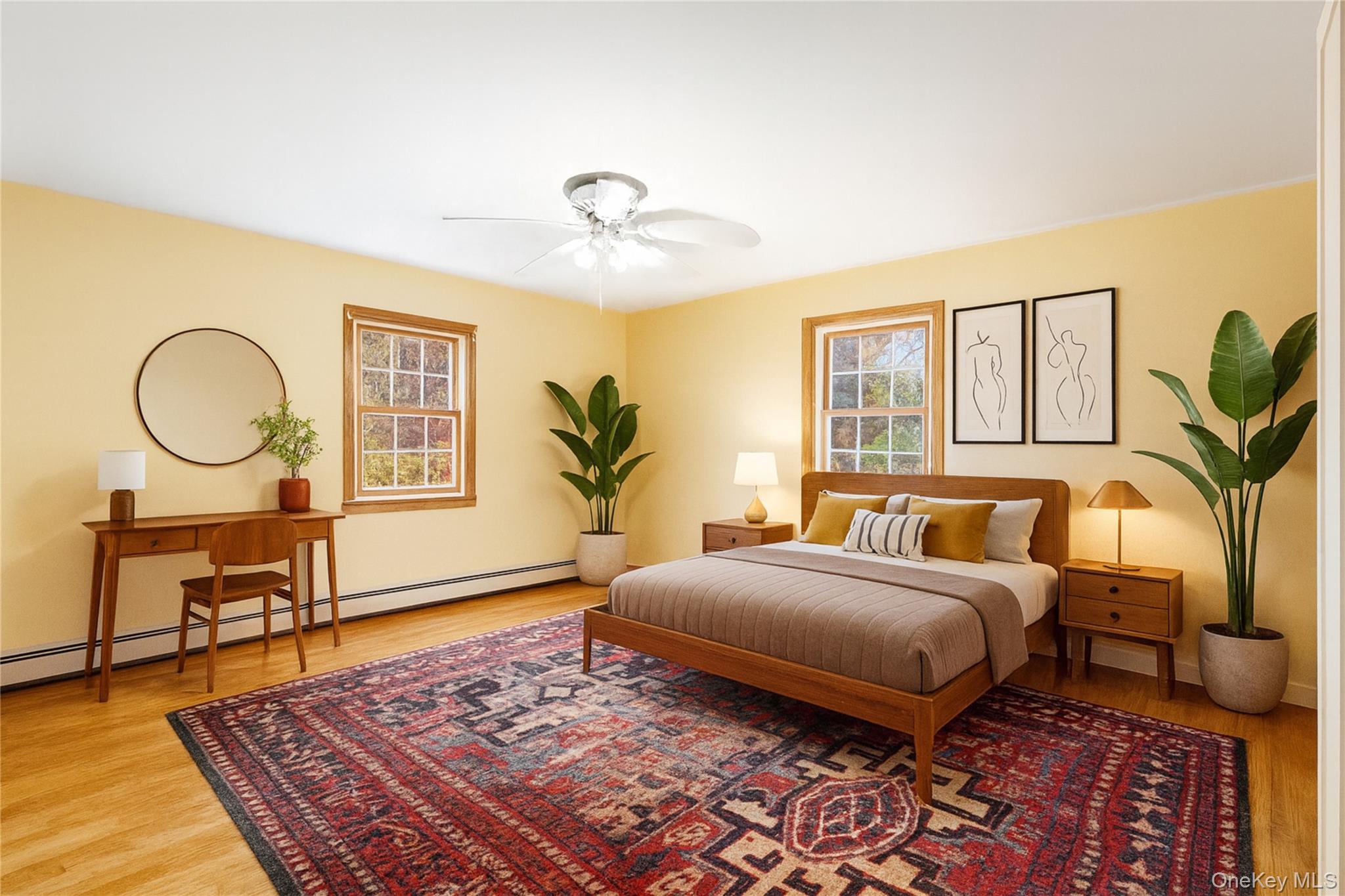 170 North Country Road Miller Place, NY 11764 - Photo 31 of 48 a bedroom with a bed a table and chair