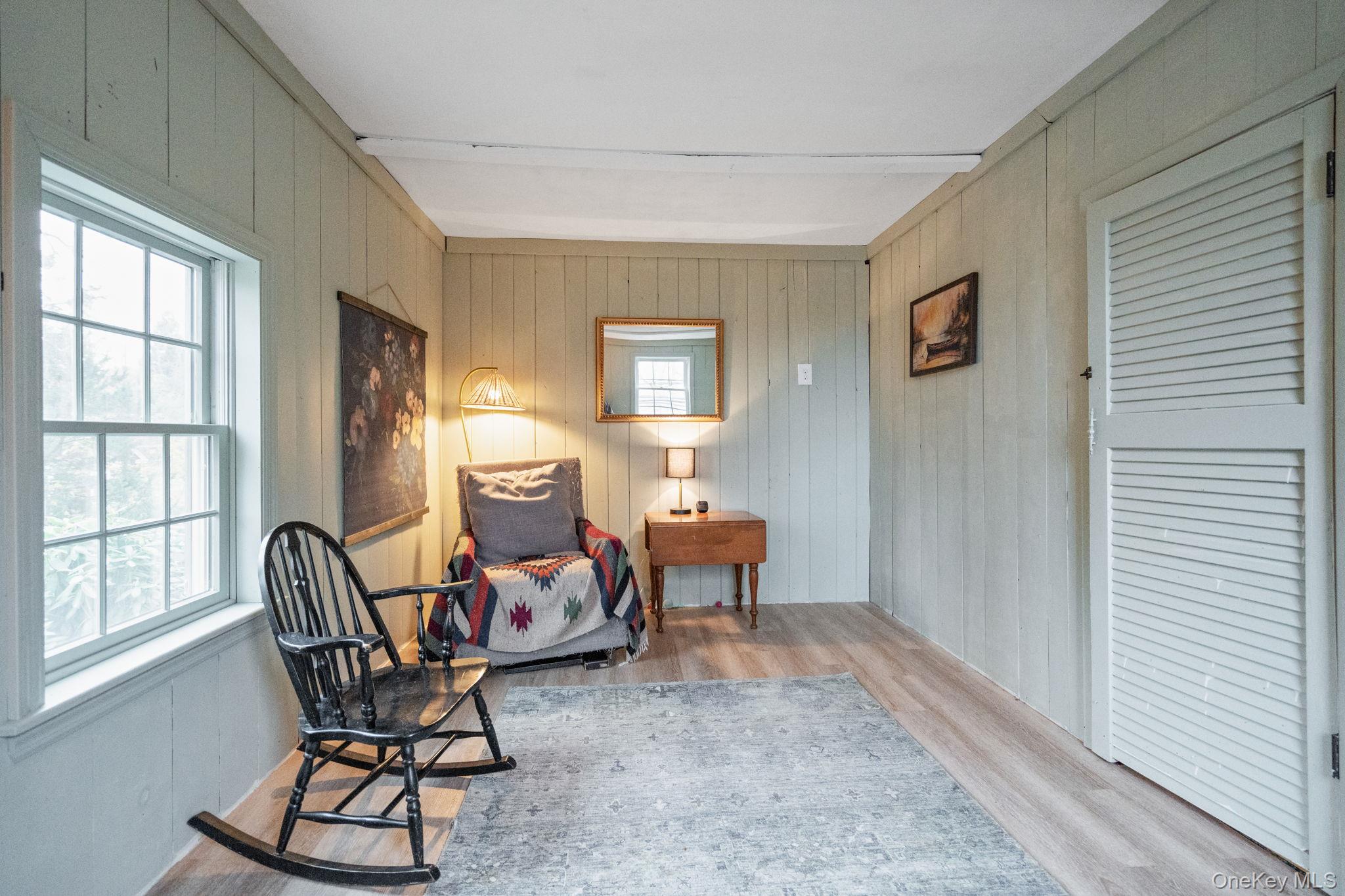 170 North Country Road Miller Place, NY 11764 - Photo 35 of 48 a living room with furniture and a window