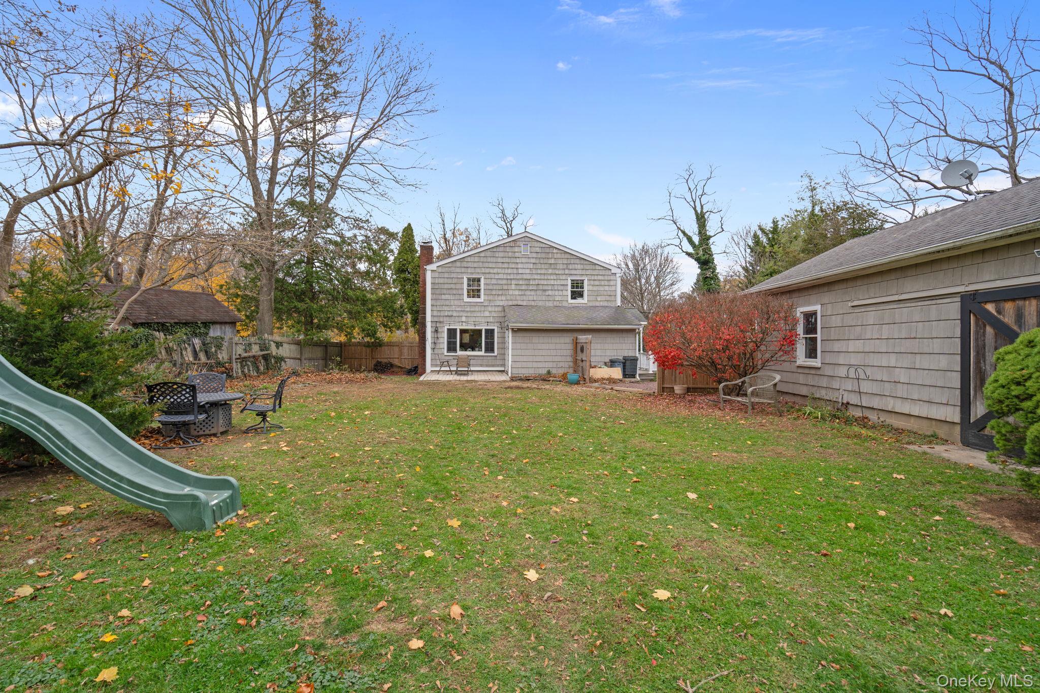 170 North Country Road Miller Place, NY 11764 - Photo 40 of 48 a front view of house with yard and seating area