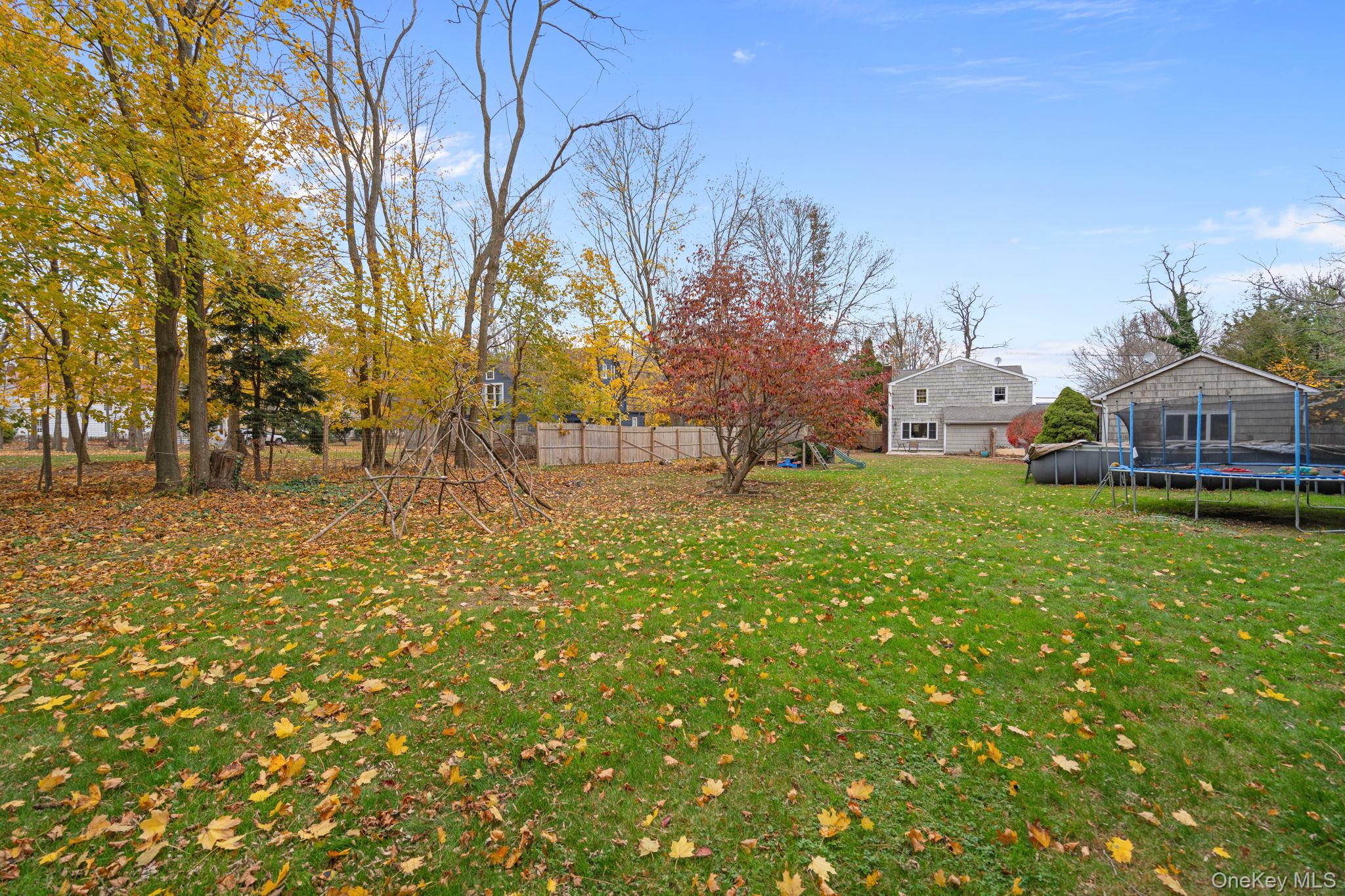 170 North Country Road Miller Place, NY 11764 - Photo 42 of 48 a view of yard with tree and green space
