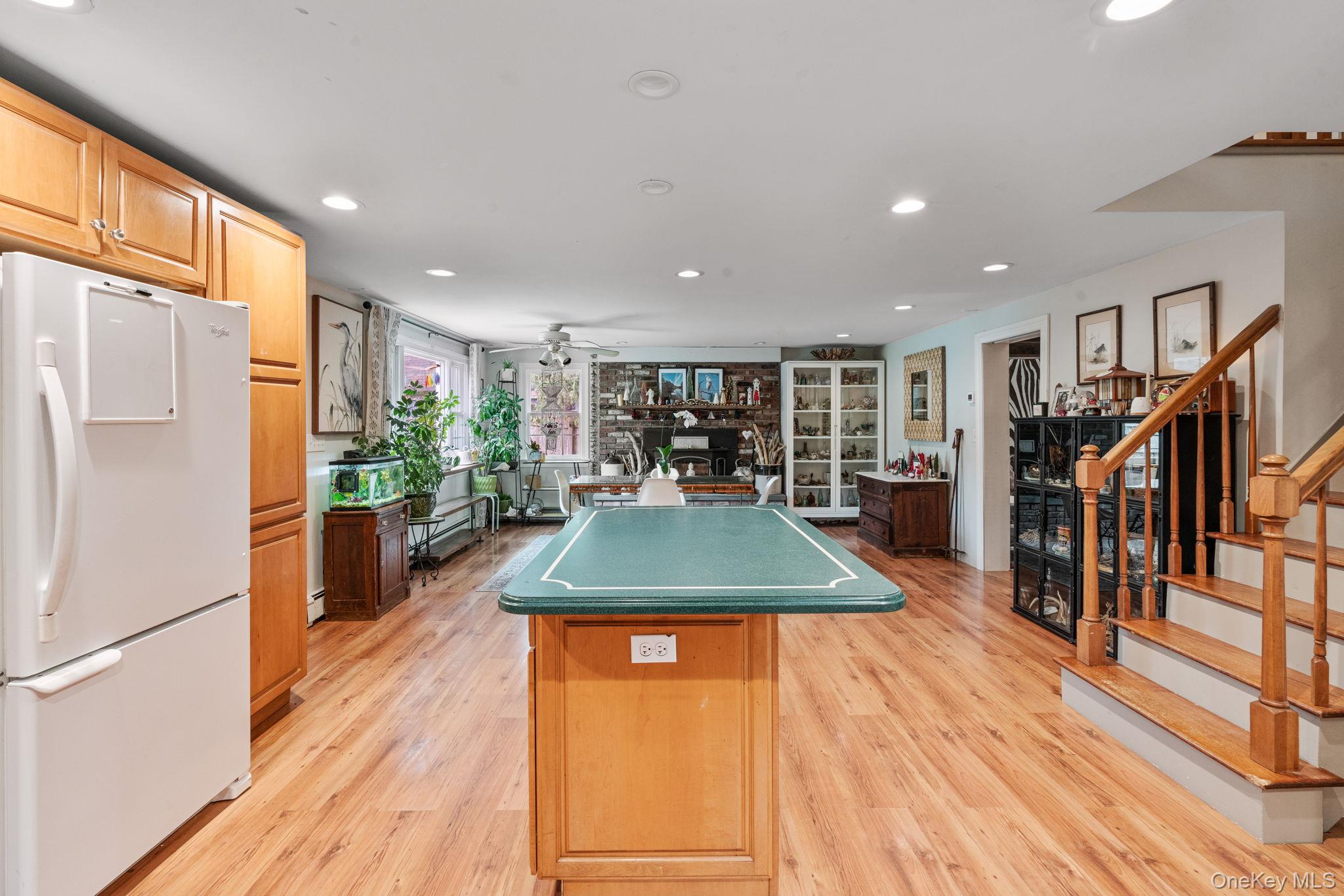 170 North Country Road Miller Place, NY 11764 - Photo 10 of 48 a room with lots of furniture and wooden floors