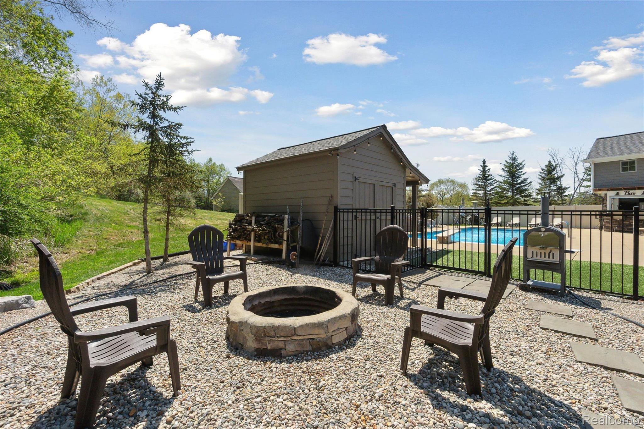 218 Locust Point Howell, MI 48843 - Photo 50 of 59 Natural Wood Firepit