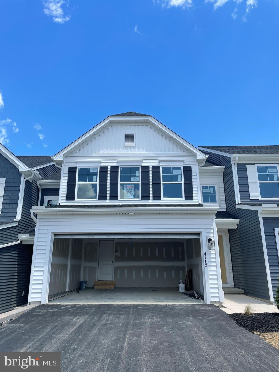 a front view of a house with a garage