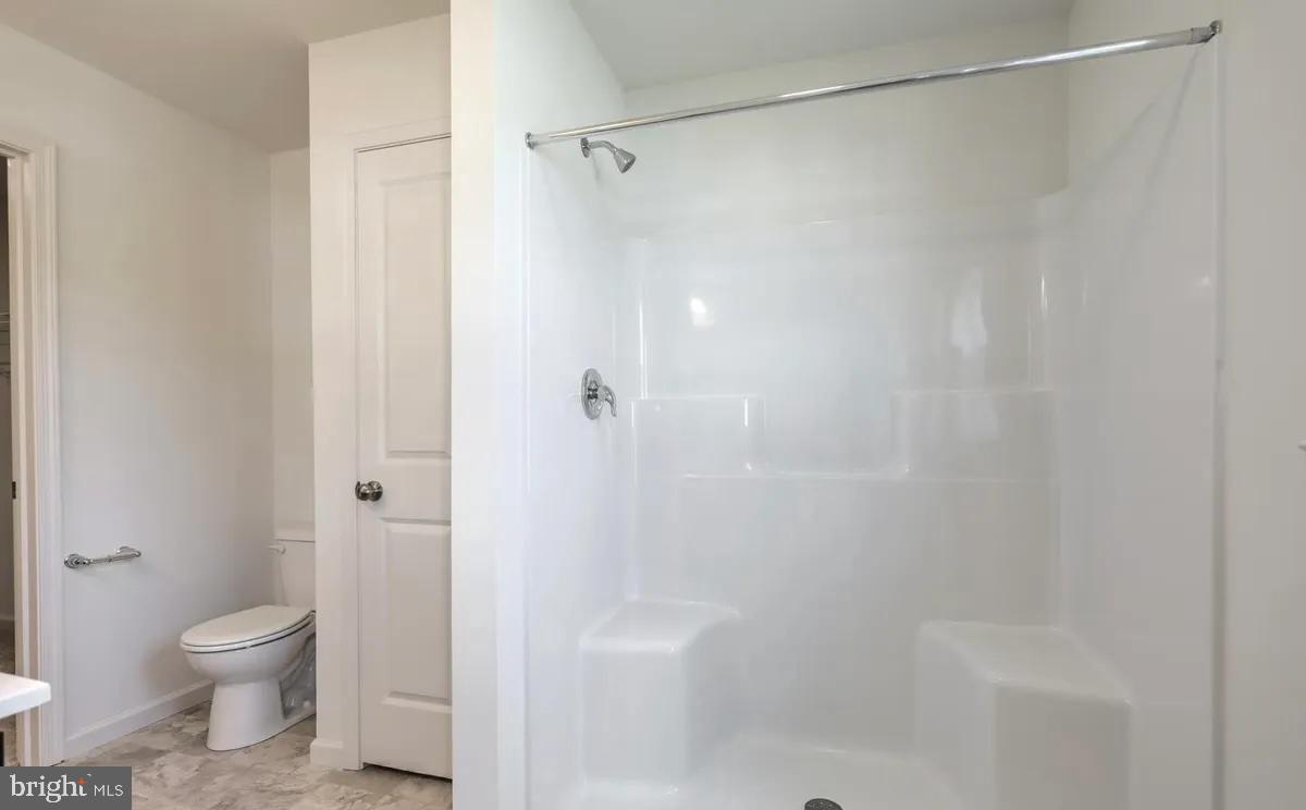 4118 Orrs Bridge Road, Unit 27 Mechanicsburg, PA 17050 - Photo 11 of 18 a bathroom with a shower and a toilet