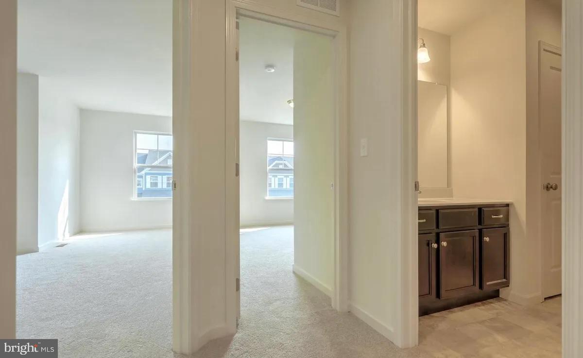 4118 Orrs Bridge Road, Unit 27 Mechanicsburg, PA 17050 - Photo 18 of 18 a view of a hallway with wooden floor