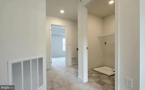 a bathroom with a granite countertop sink and toilet