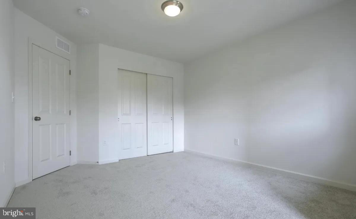 4118 Orrs Bridge Road, Unit 27 Mechanicsburg, PA 17050 - Photo 8 of 18 a view of an empty room and window