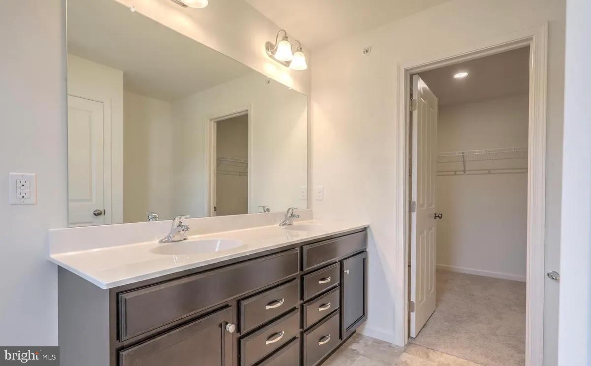 4118 Orrs Bridge Road, Unit 27 Mechanicsburg, PA 17050 - Photo 10 of 18 a bathroom with a sink and a mirror