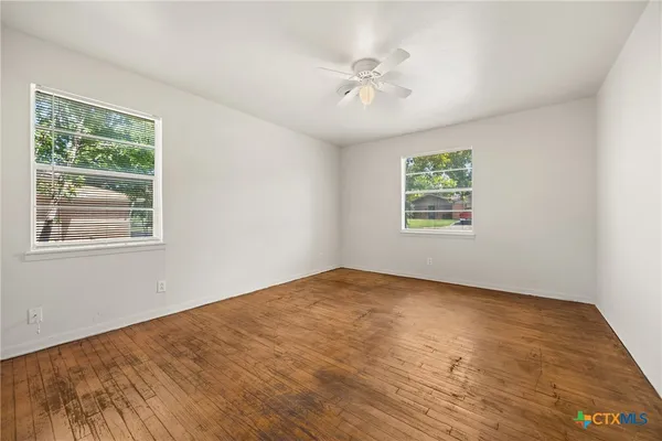 a view of an empty room with a window