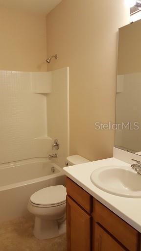 7652 Ripplepointe Way Windermere, FL 34786 - Photo 12 of 21 a bathroom with a sink a toilet and shower