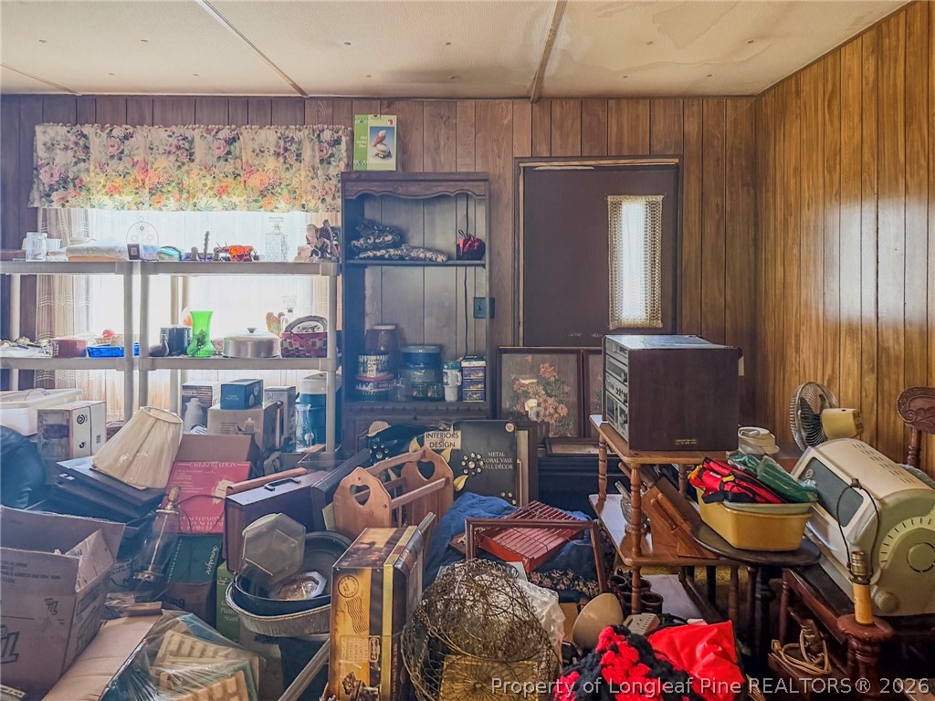 1308 Mac D Road Orrum, NC 28369 - Photo 17 of 32 a room with furniture a rug and a window