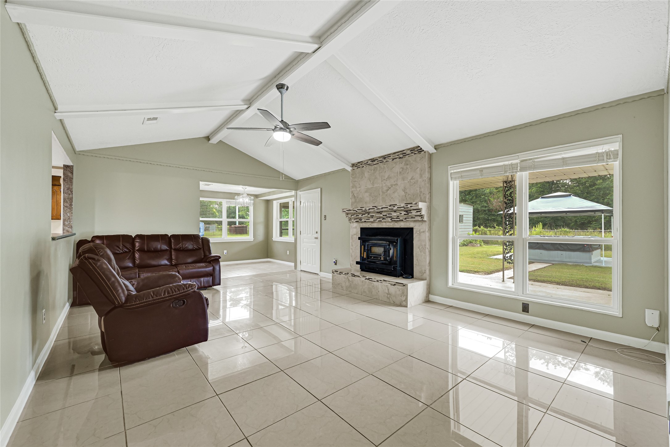 20135 Timber Line Lane New Caney, TX 77357 - Photo 9 of 30 a living room with furniture and a fireplace