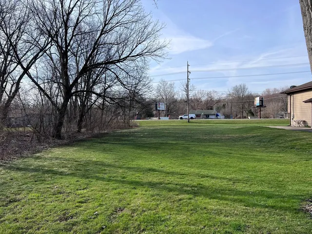a backyard of a house with lots of green space