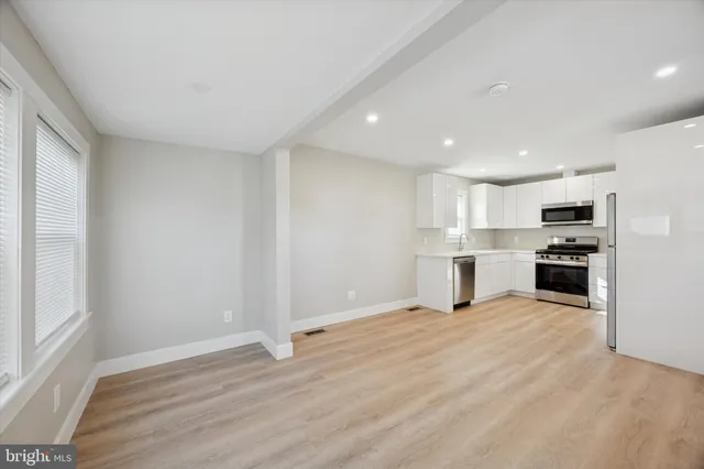 a view of kitchen with wooden floor