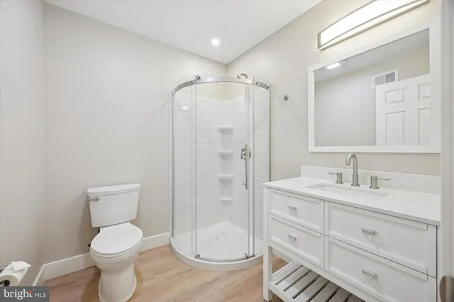 a view of hallway with wooden floor