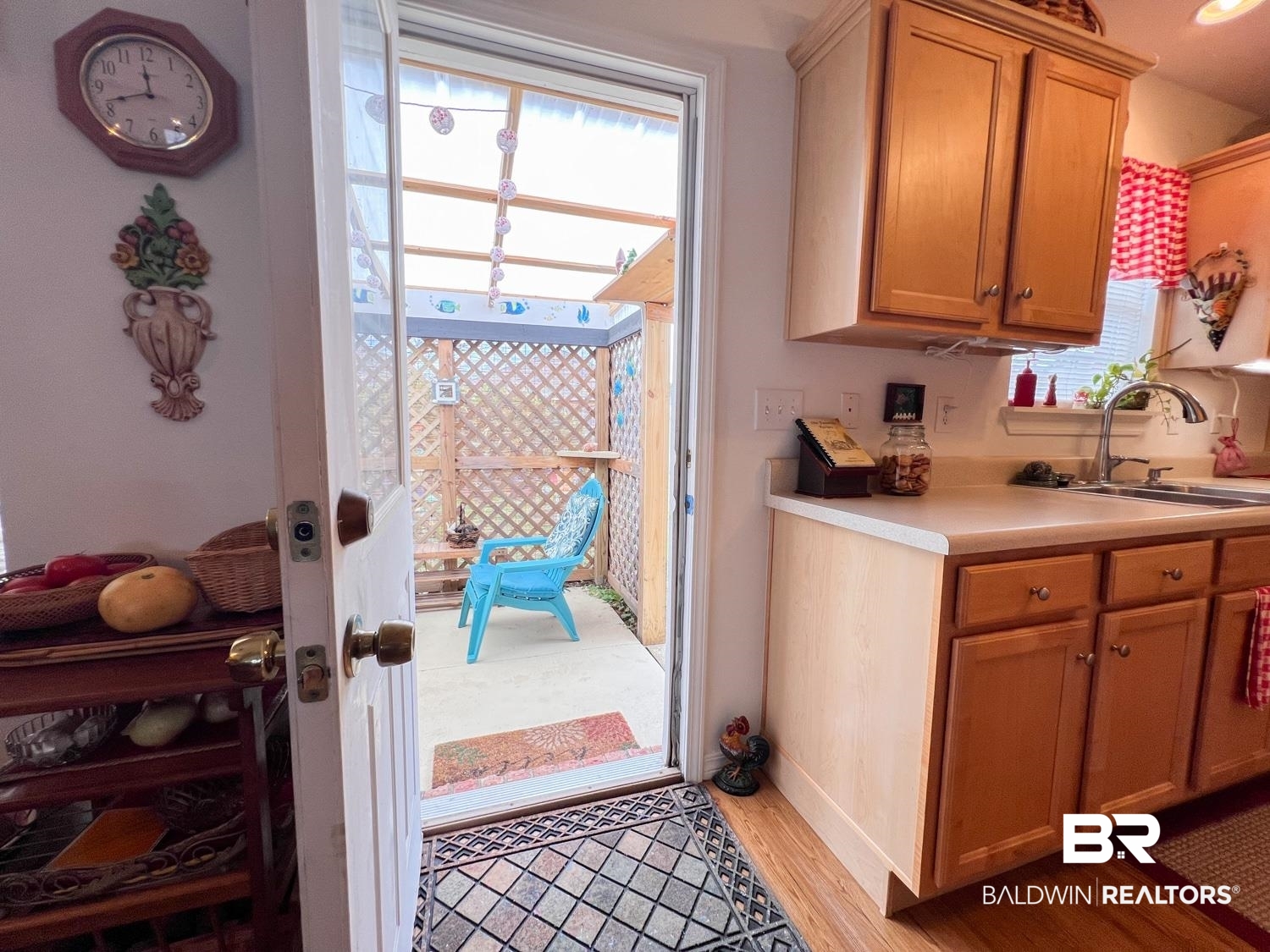 16690 Plum Court Loxley, AL 36551 - Photo 25 of 30 Kitchen with sink and light hardwood / wood-style flooring