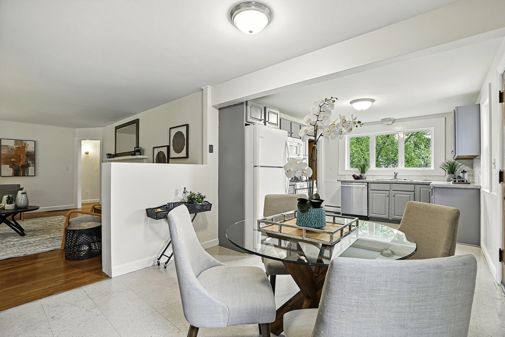 110 Bethany Road Framingham, MA 01702 - Photo 11 of 42 a living room with furniture and a table