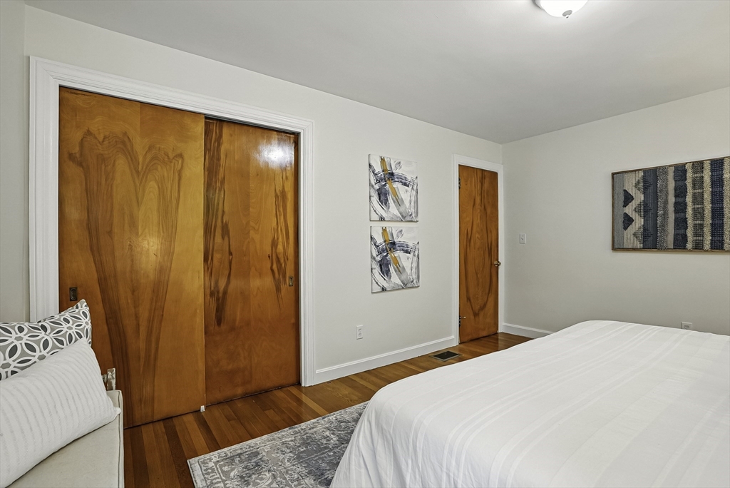 110 Bethany Road Framingham, MA 01702 - Photo 24 of 42 a bedroom with a large bed and a window