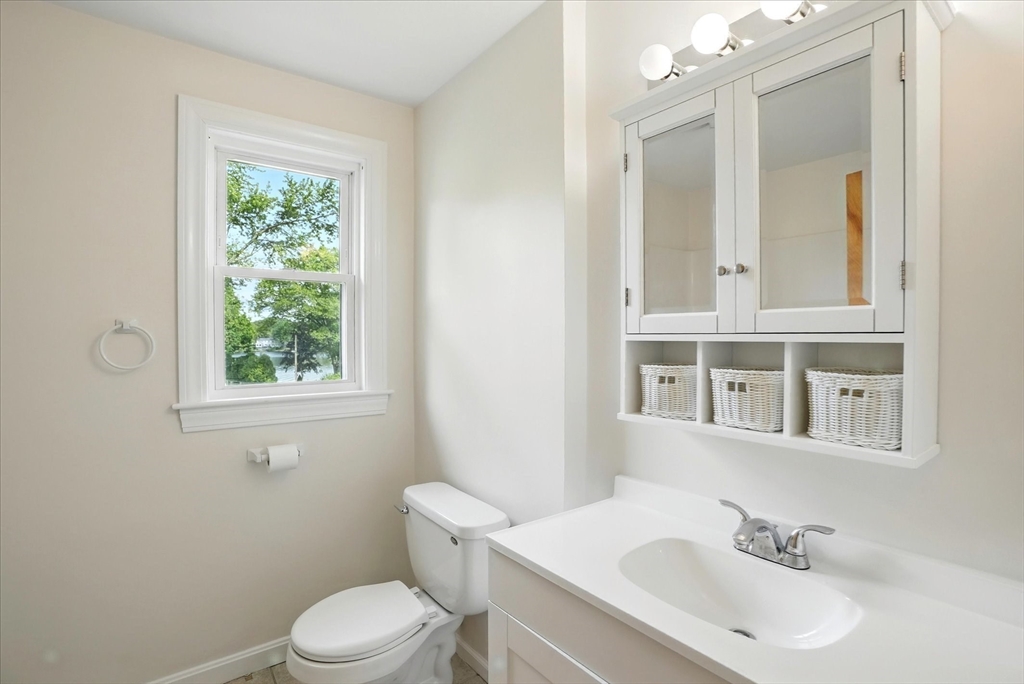 110 Bethany Road Framingham, MA 01702 - Photo 26 of 42 a bathroom with a sink a toilet and a window