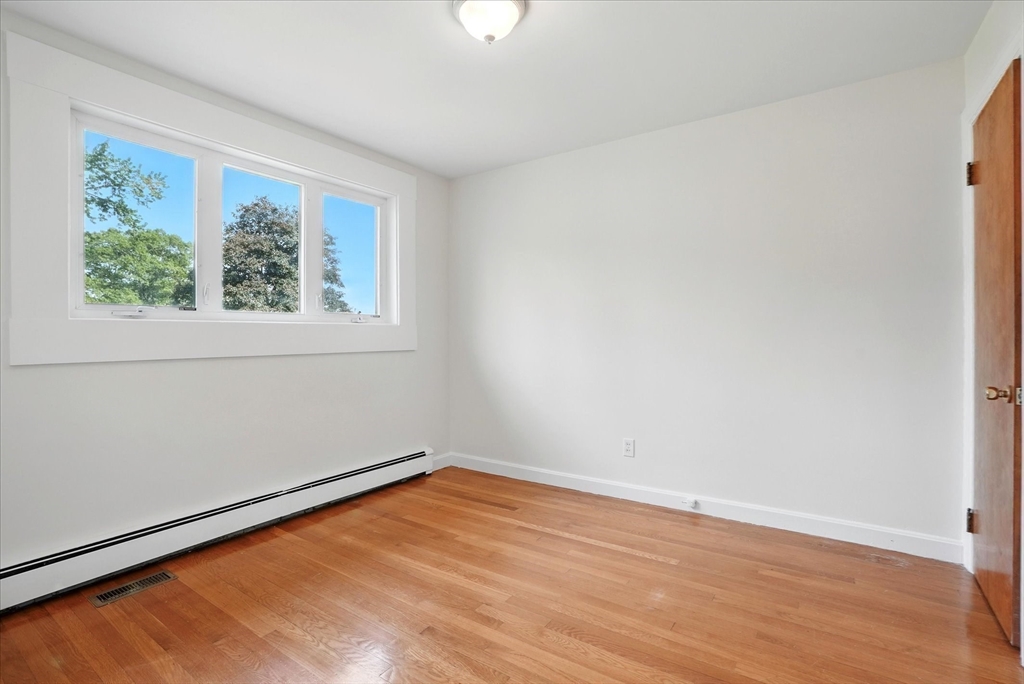 110 Bethany Road Framingham, MA 01702 - Photo 28 of 42 wooden floor in an empty room with a window