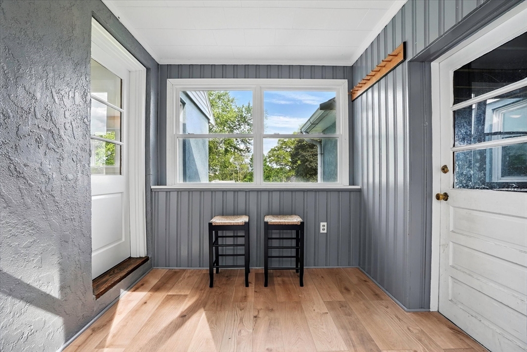 110 Bethany Road Framingham, MA 01702 - Photo 3 of 42 a dining room with a wooden table and chairs