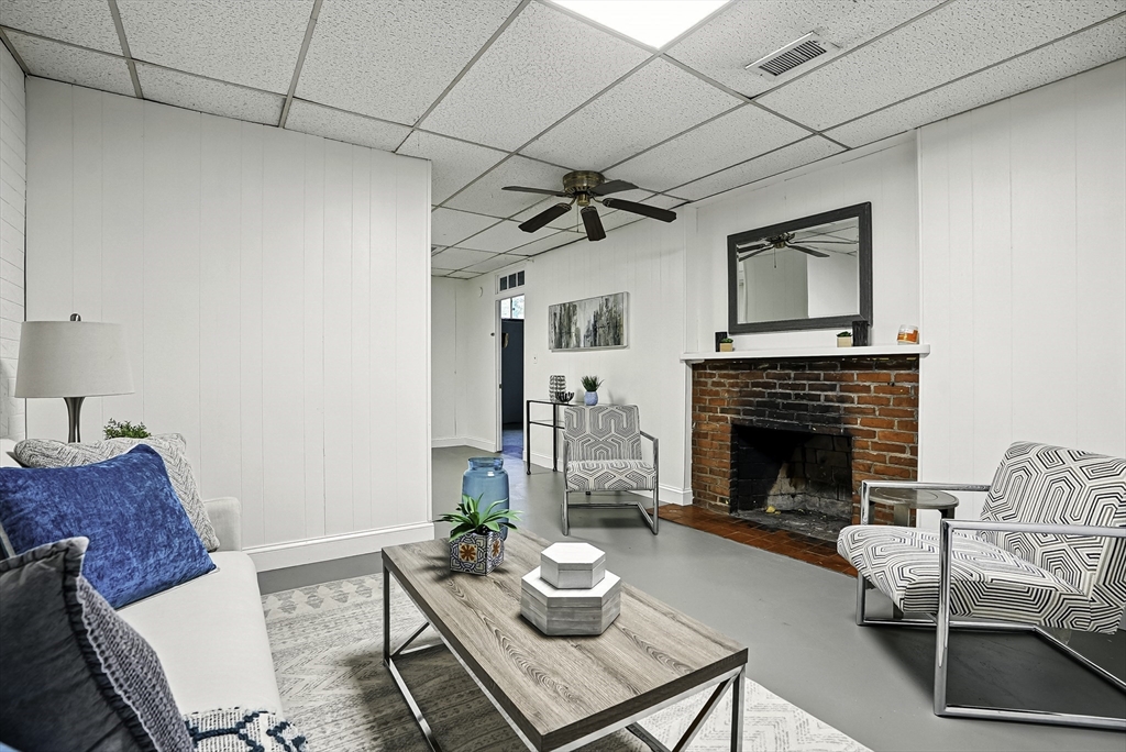 110 Bethany Road Framingham, MA 01702 - Photo 32 of 42 a living room with furniture and a fireplace