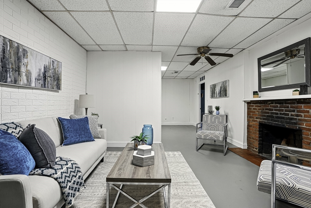 110 Bethany Road Framingham, MA 01702 - Photo 35 of 42 a living room with furniture and a fireplace