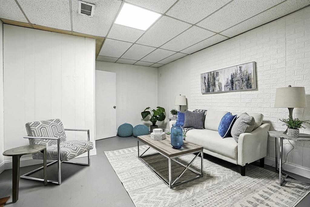 110 Bethany Road Framingham, MA 01702 - Photo 36 of 42 a living room with furniture and wooden floor