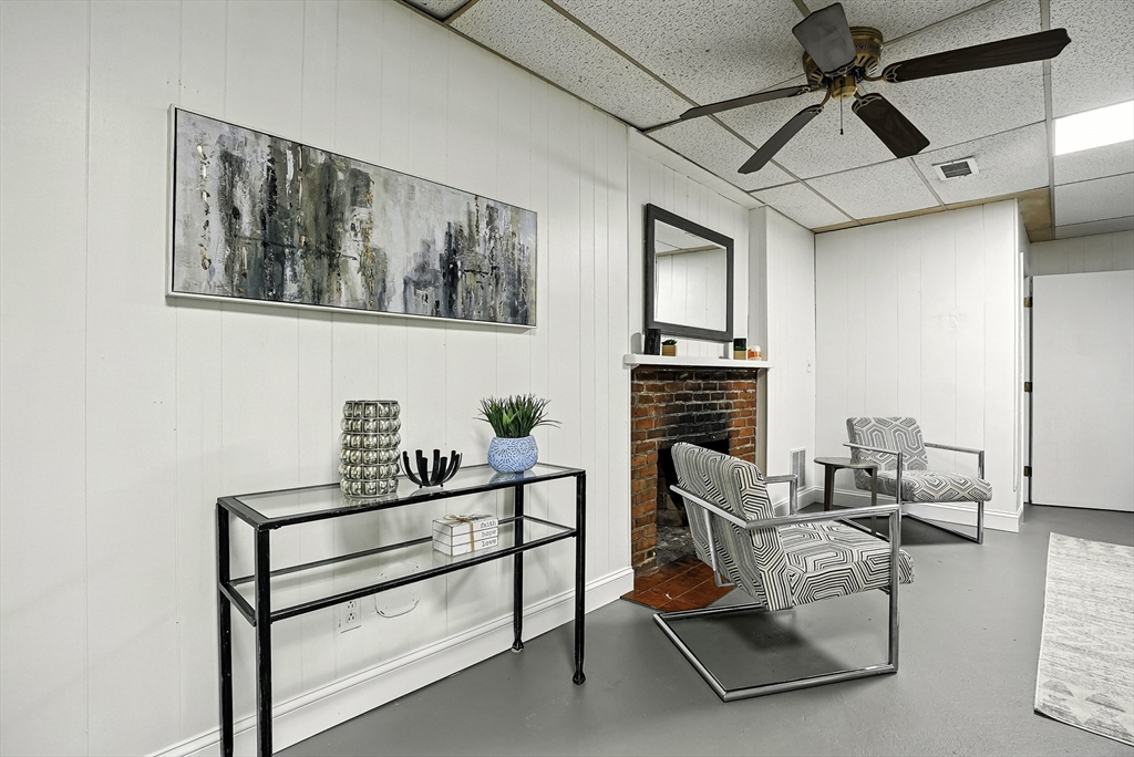 110 Bethany Road Framingham, MA 01702 - Photo 37 of 42 a living room with furniture and a fireplace