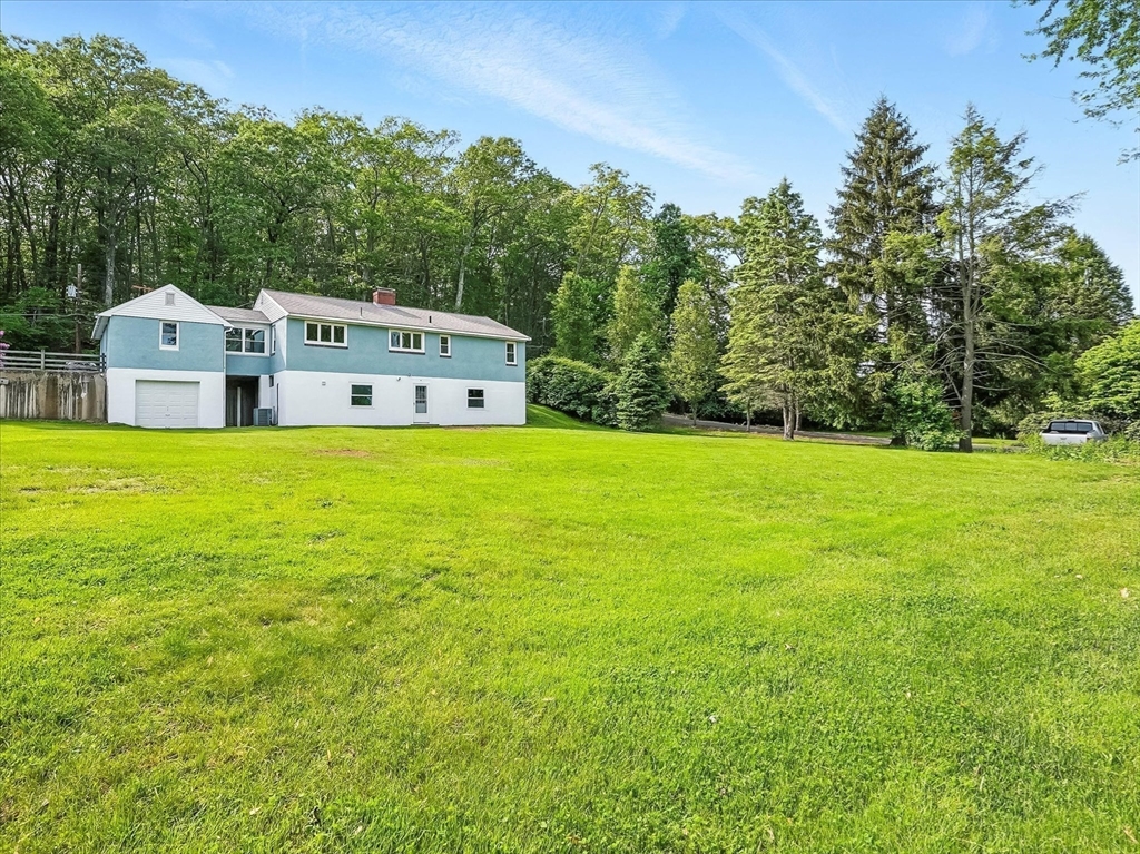 110 Bethany Road Framingham, MA 01702 - Photo 39 of 42 a front view of a house with a big yard