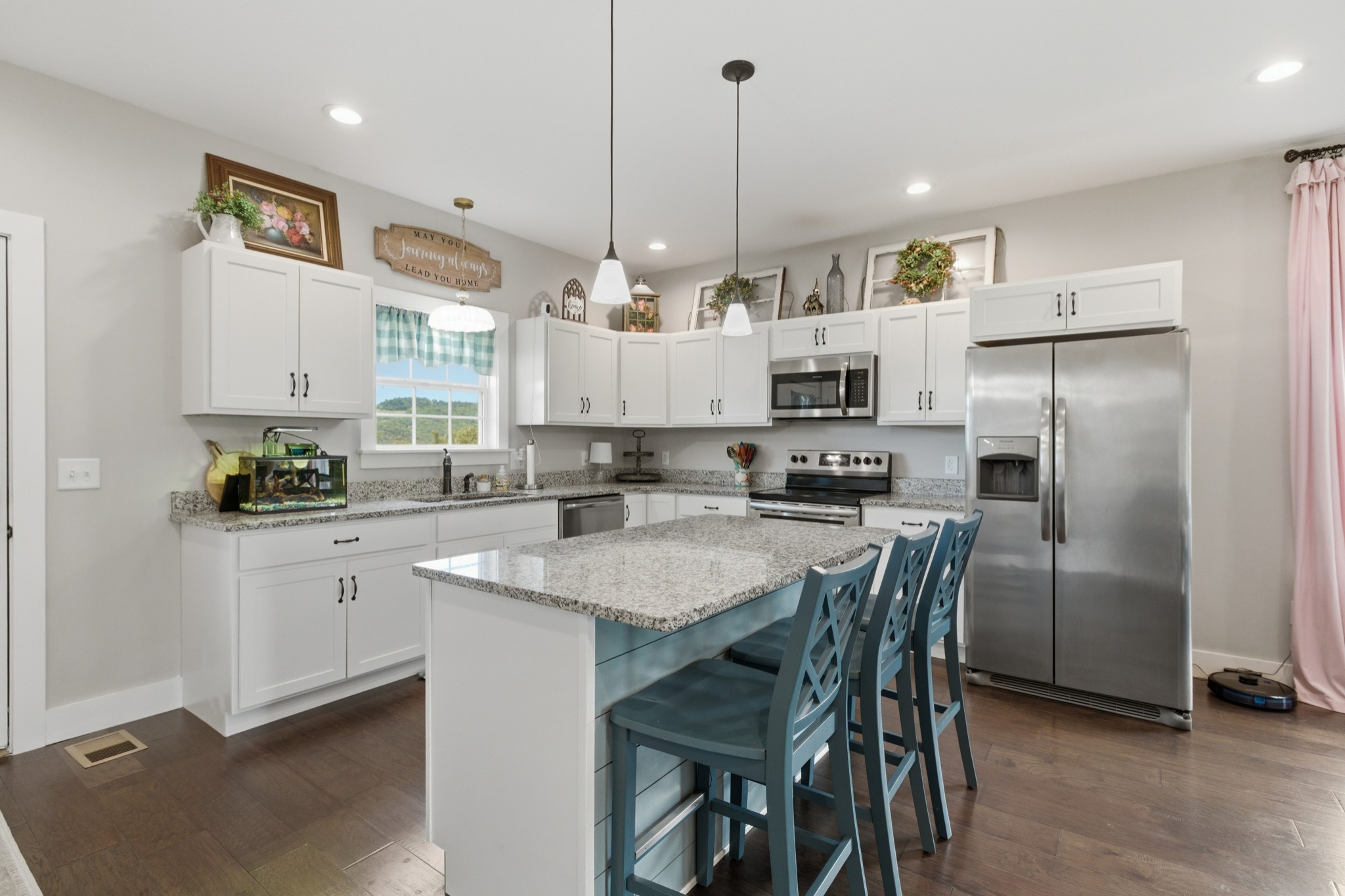 184 Lebanon Highway Carthage, TN 37030 - Photo 12 of 36 a kitchen with stainless steel appliances granite countertop a refrigerator a stove a sink dishwasher a stove and white cabinets with wooden floor