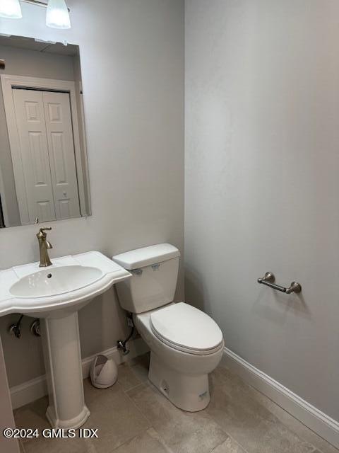125 Hamilton Avenue, Unit 2 Greenwich, CT 06830 - Photo 16 of 20 a white toilet sitting next to a bathroom sink
