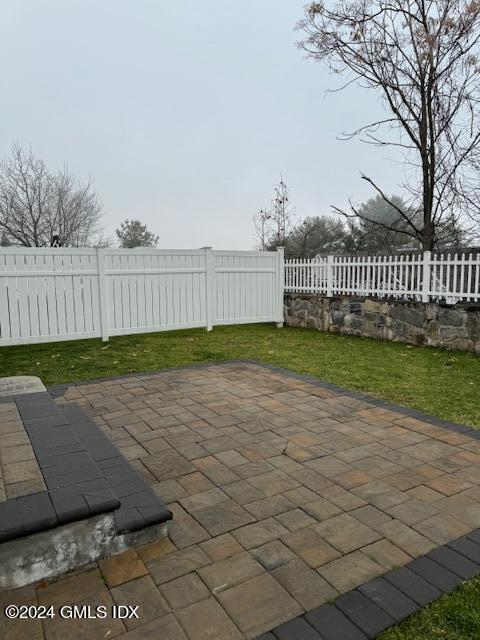 125 Hamilton Avenue, Unit 2 Greenwich, CT 06830 - Photo 18 of 20 a view of a bench in a yard