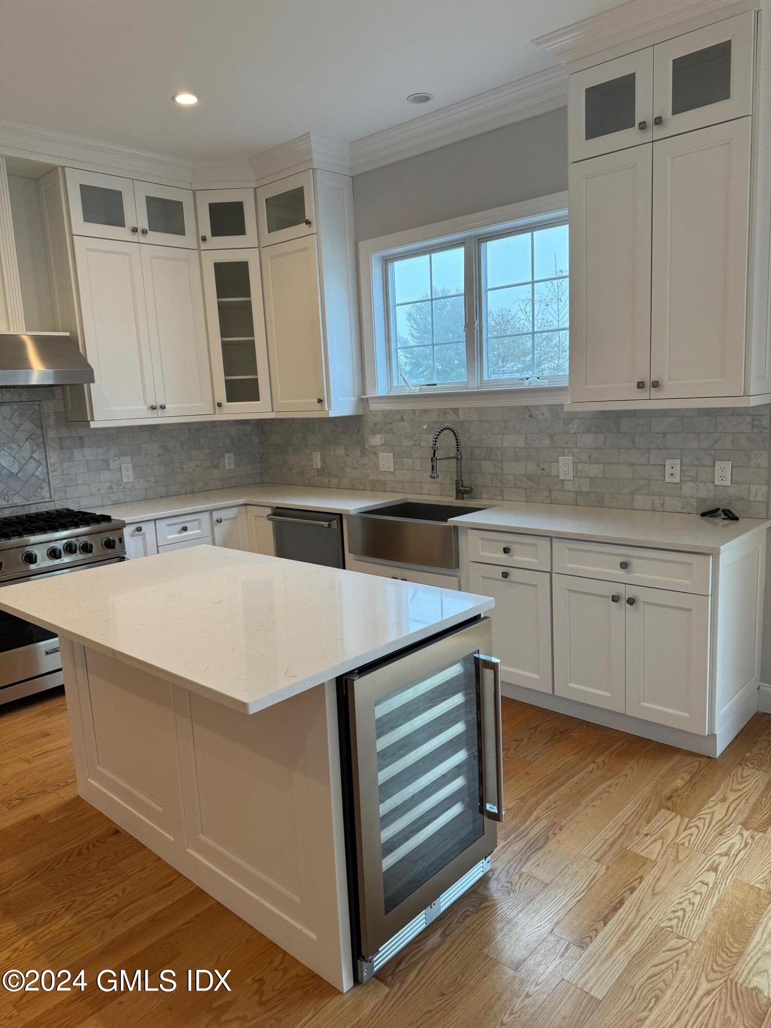 125 Hamilton Avenue, Unit 2 Greenwich, CT 06830 - Photo 2 of 20 a kitchen that has a sink a stove and cabinets