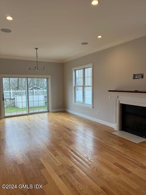 125 Hamilton Avenue, Unit 2 Greenwich, CT 06830 - Photo 6 of 20 an empty room with wooden floor and windows