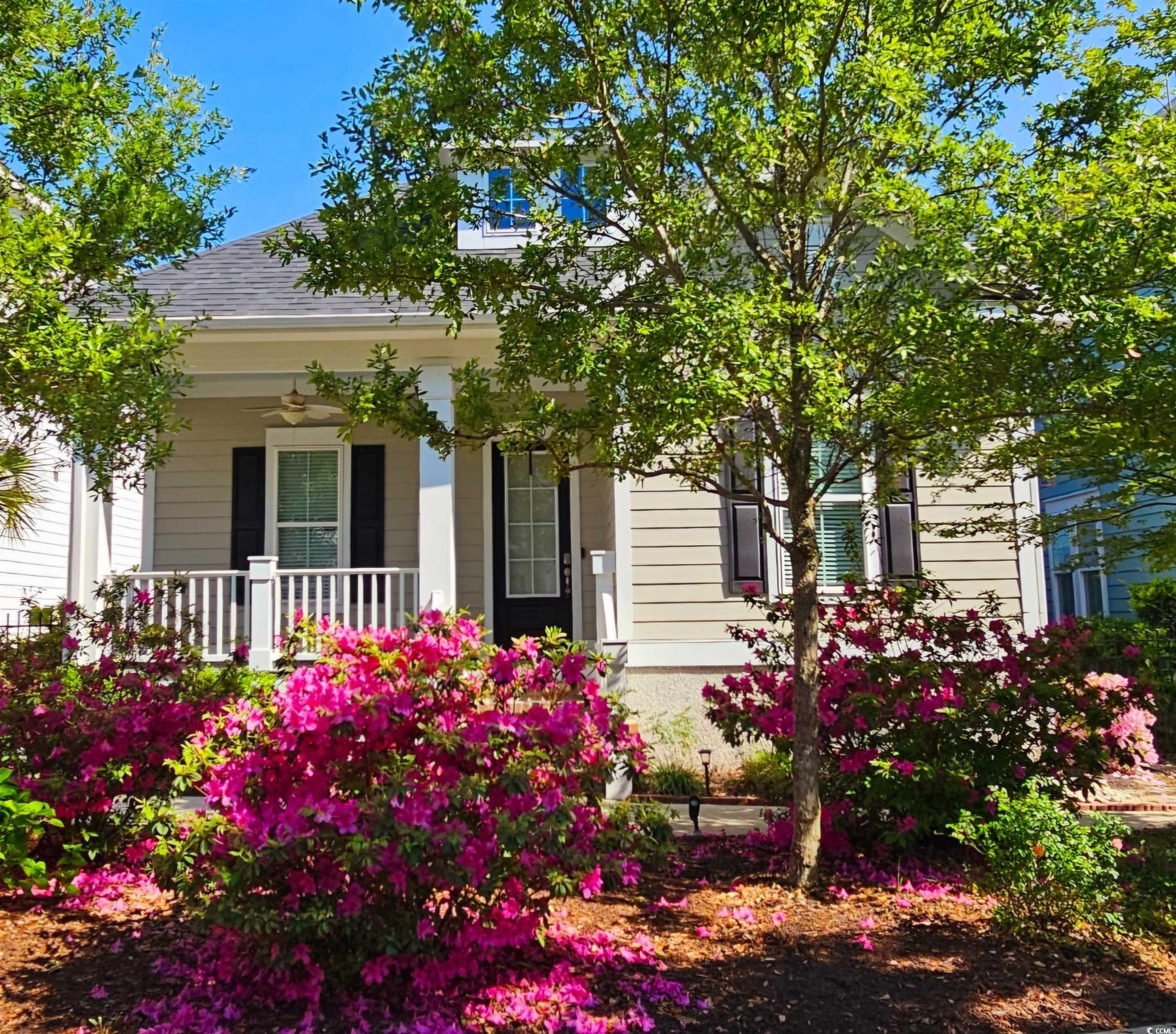 View of front facade with roof with shingles and a